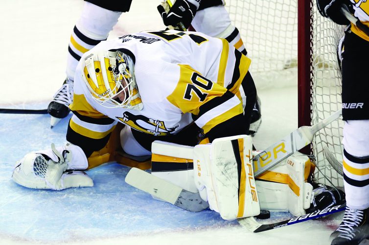 Domingue says he’s happy to be on the ice with Pens